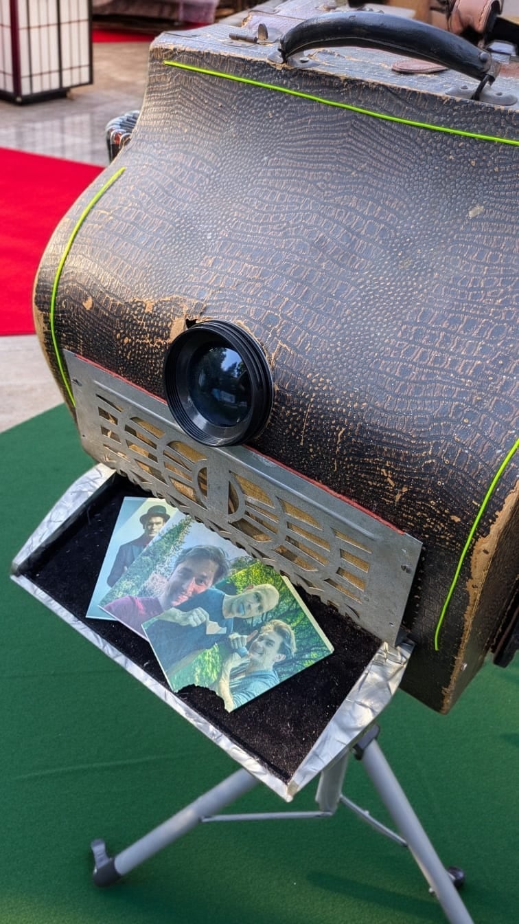 Finished edible-paper portraits on the tray of the historic plate camera